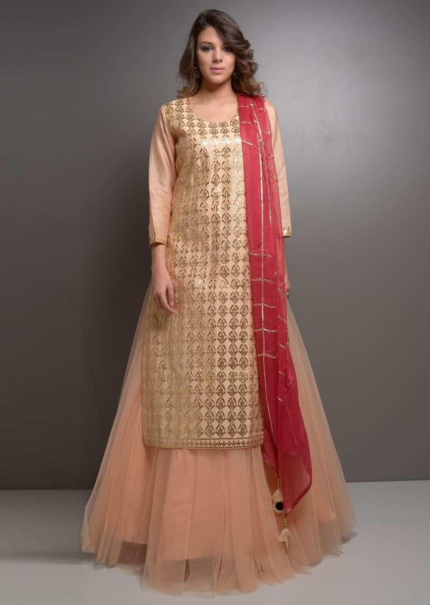 Peach gotta jaal suit with net skirt and red chiffon dupatta