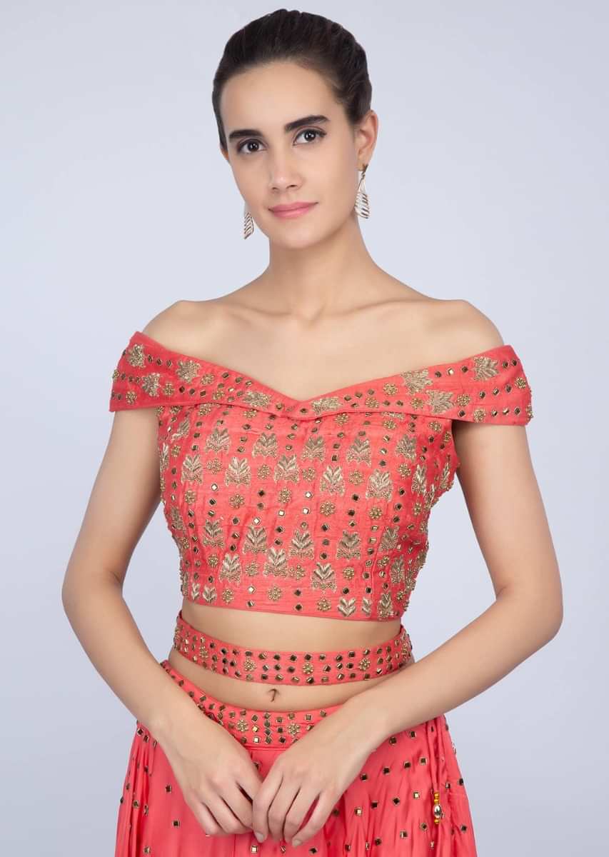 Peach lehenga with embroidered off shoulder blouse and net dupatta  only on kalki