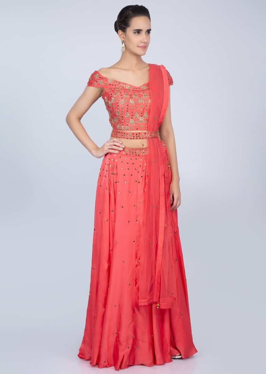 Peach lehenga with embroidered off shoulder blouse and net dupatta  only on kalki