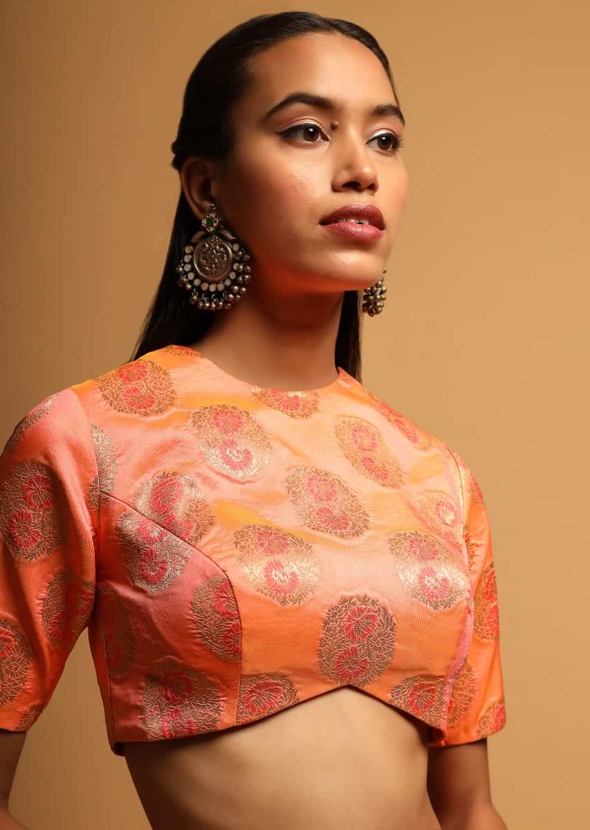 Peach Two Toned Blouse In Brocade Silk With Woven Floral Buttis And Curved Hemline