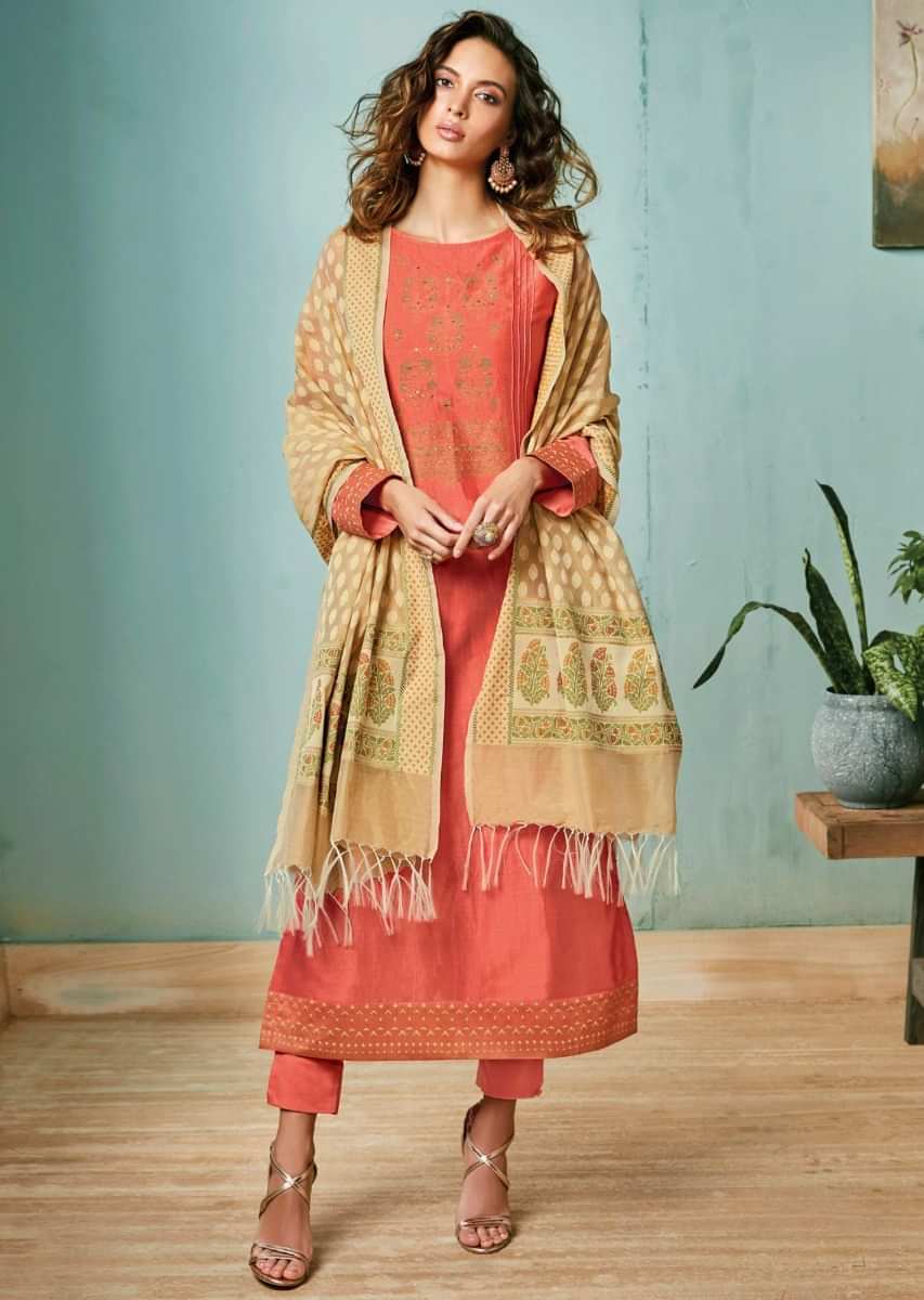 Peach unstitched suit adorn in foil printed placket in floral motif matched with beige dupatta
