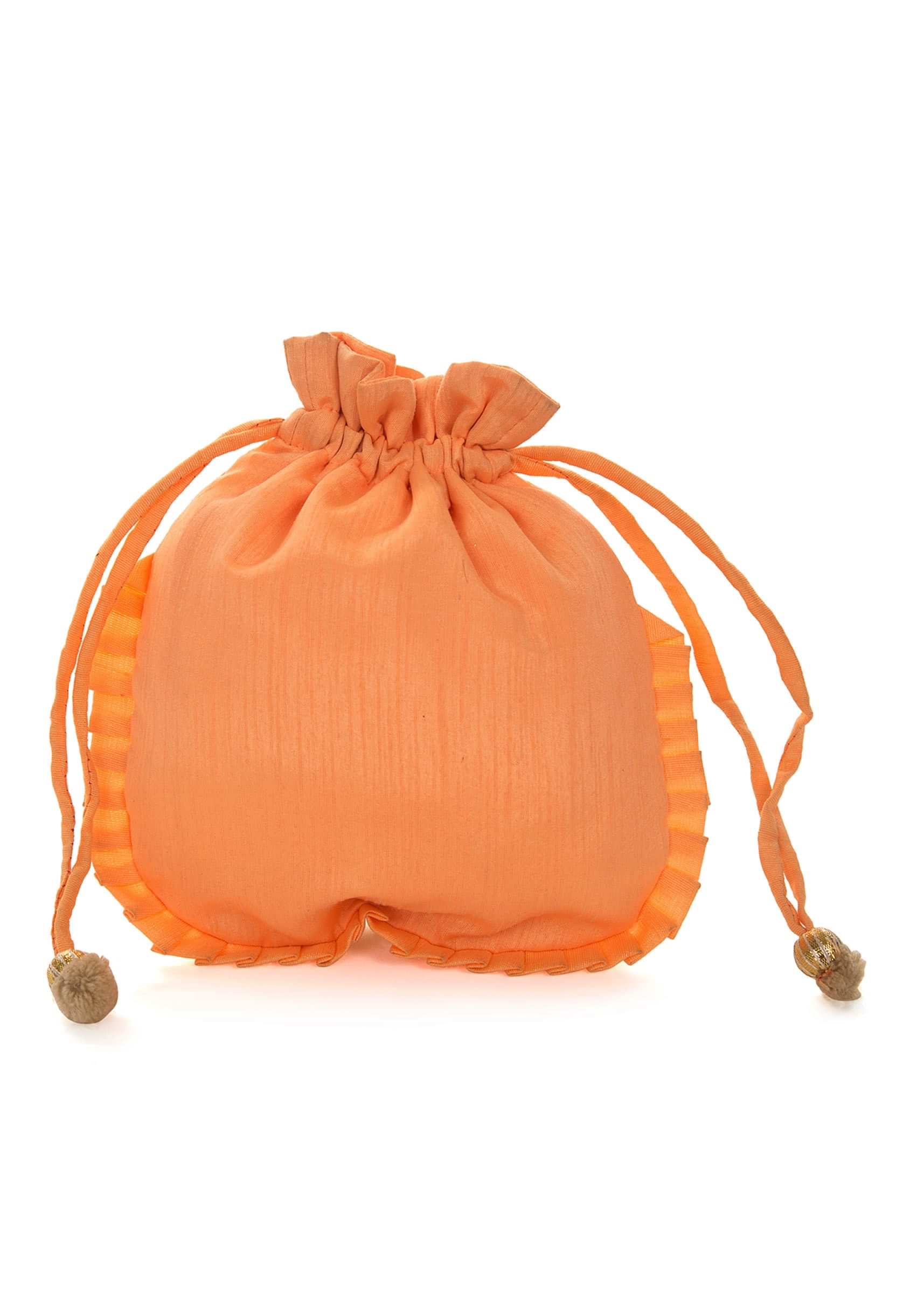 Peach potli bag beautified in gotta patti embroidered work only on Kalki