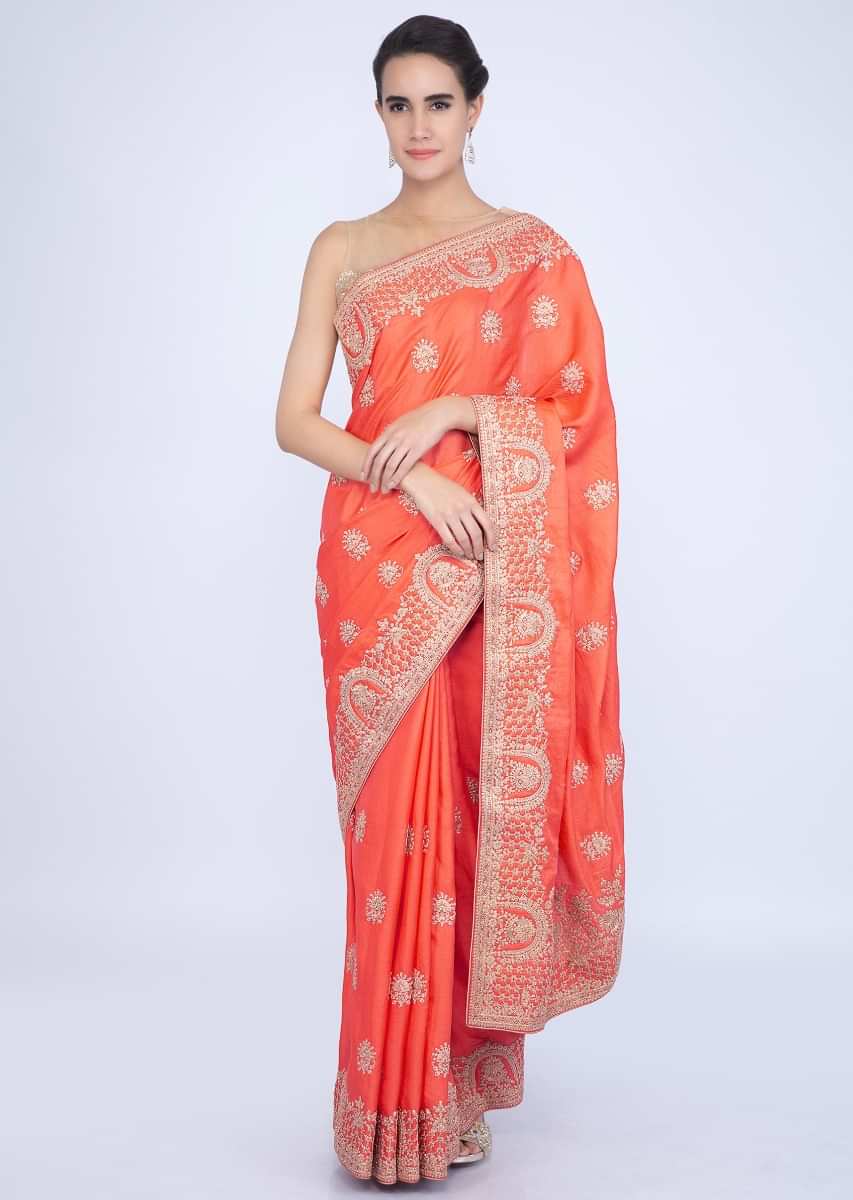 Peachish orange cotton silk saree in cord embroidered butti and border only on Kalki