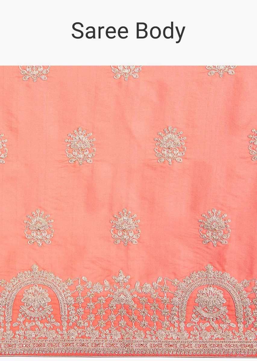 Peachish orange cotton silk saree in cord embroidered butti and border only on Kalki