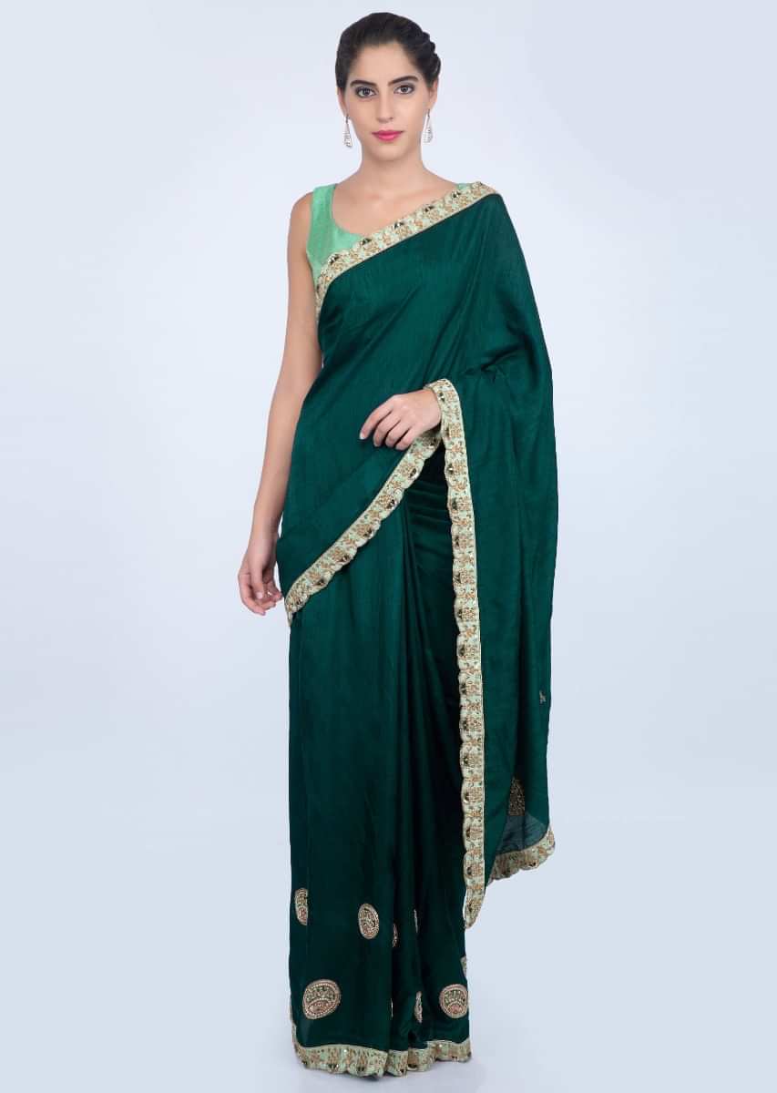 Peacock green dupion silk saree with embroidered butti and border only on kalki