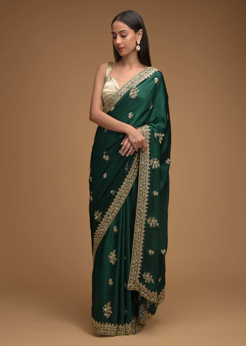 Bottle Green Saree In Satin With Hand Embroidered Floral Buttis Using Cut Dana And Sequins Work Along With Unstitched Blouse  
