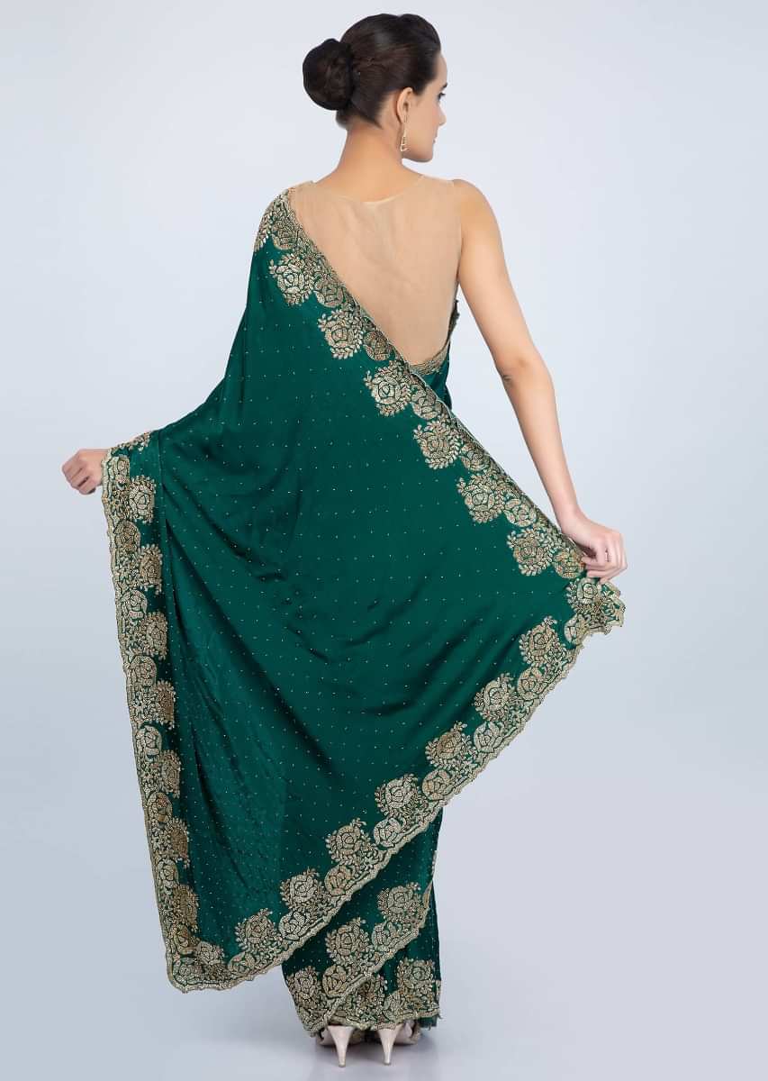 Peacock green satin saree with cut dana floral embroidered border only on Kalki