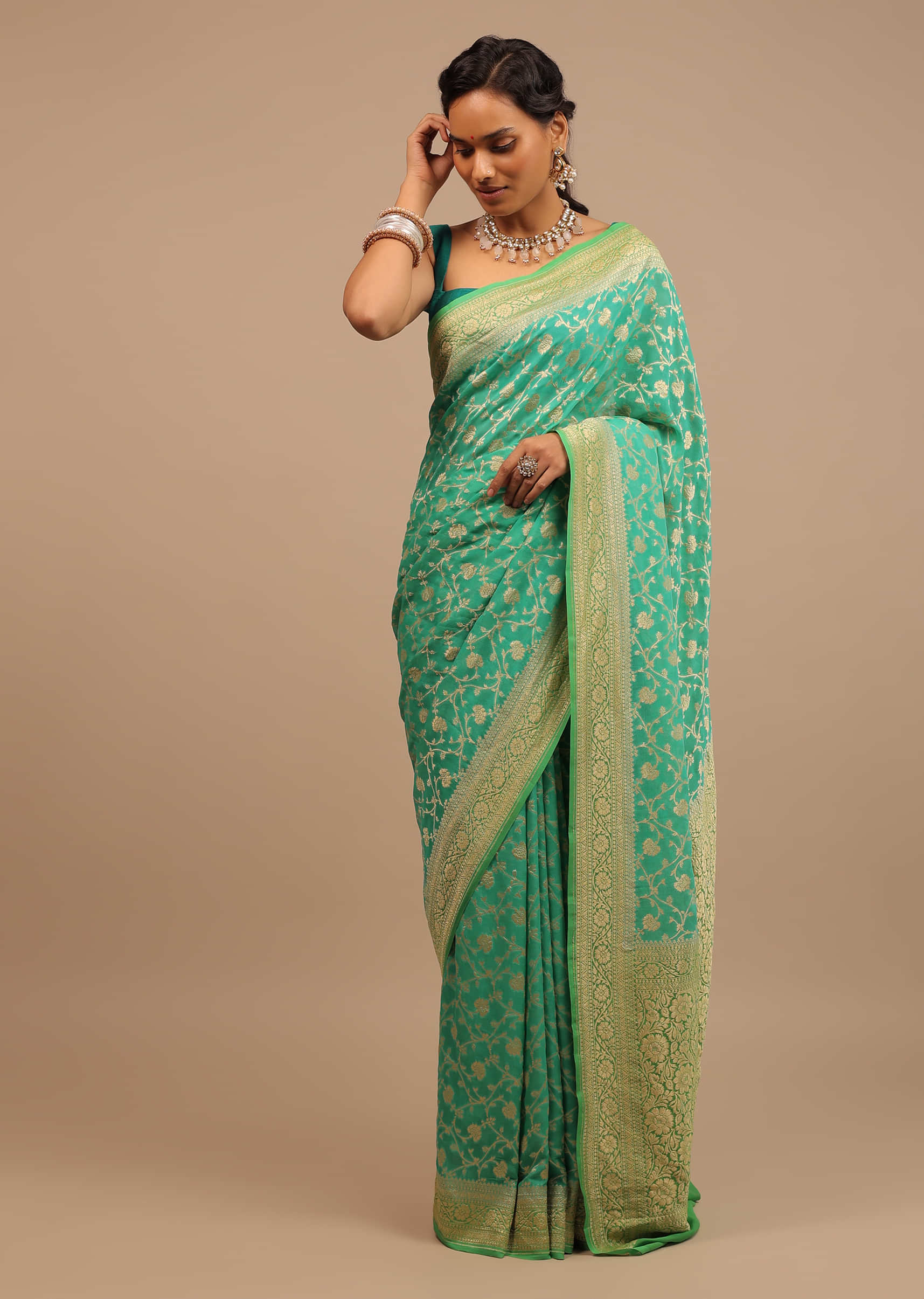 Peacock Green Traditional Saree Made With Georgette And A Beautiful Woven Floral Jaal