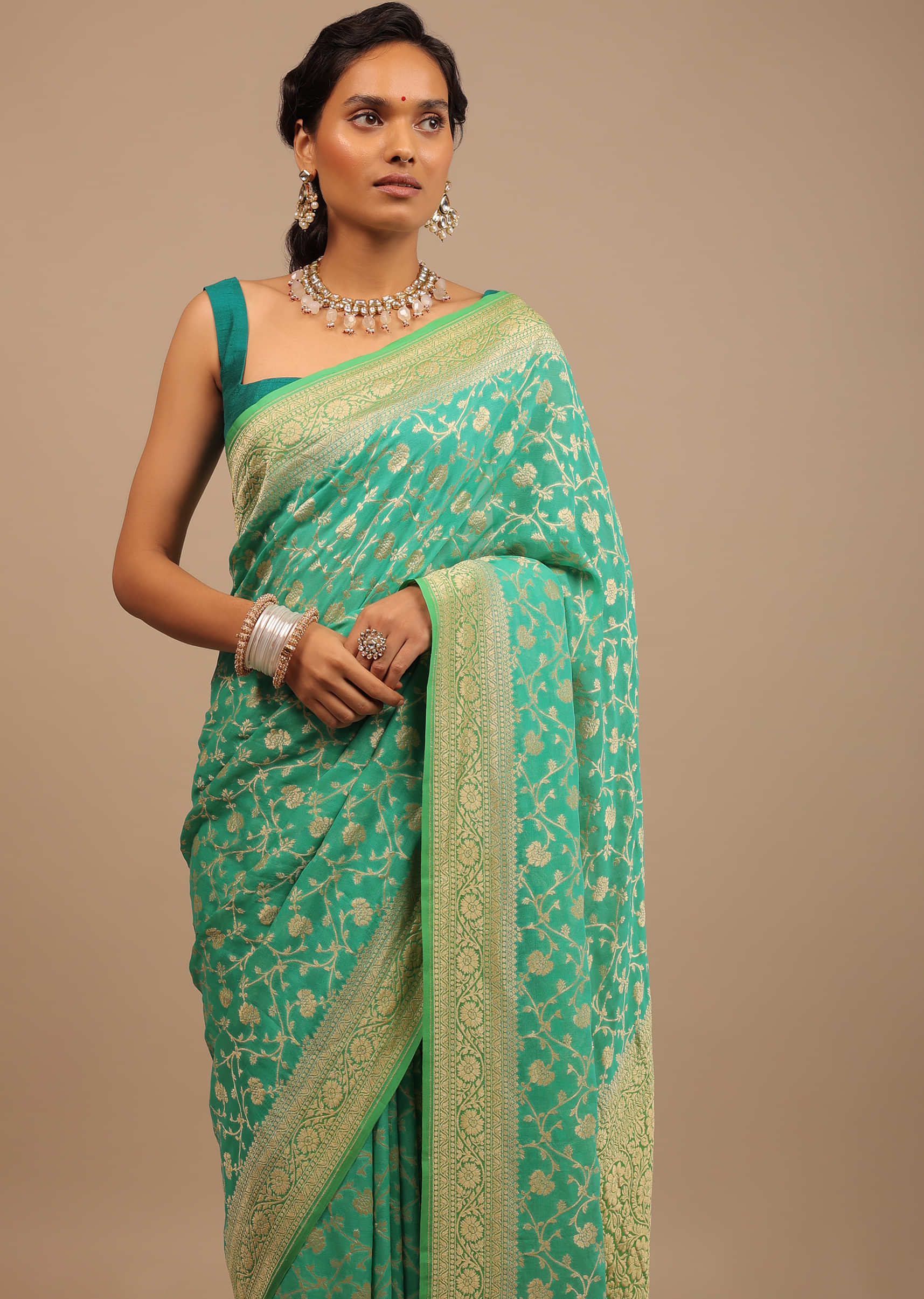 Peacock Green Traditional Saree Made With Georgette And A Beautiful Woven Floral Jaal