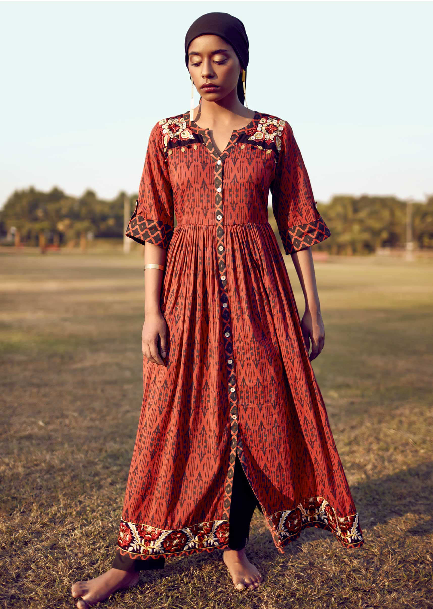 Persian Red A Line Suit In Cotton With Tribal Print And Colorful Resham Flowers On The Yoke And Hem  