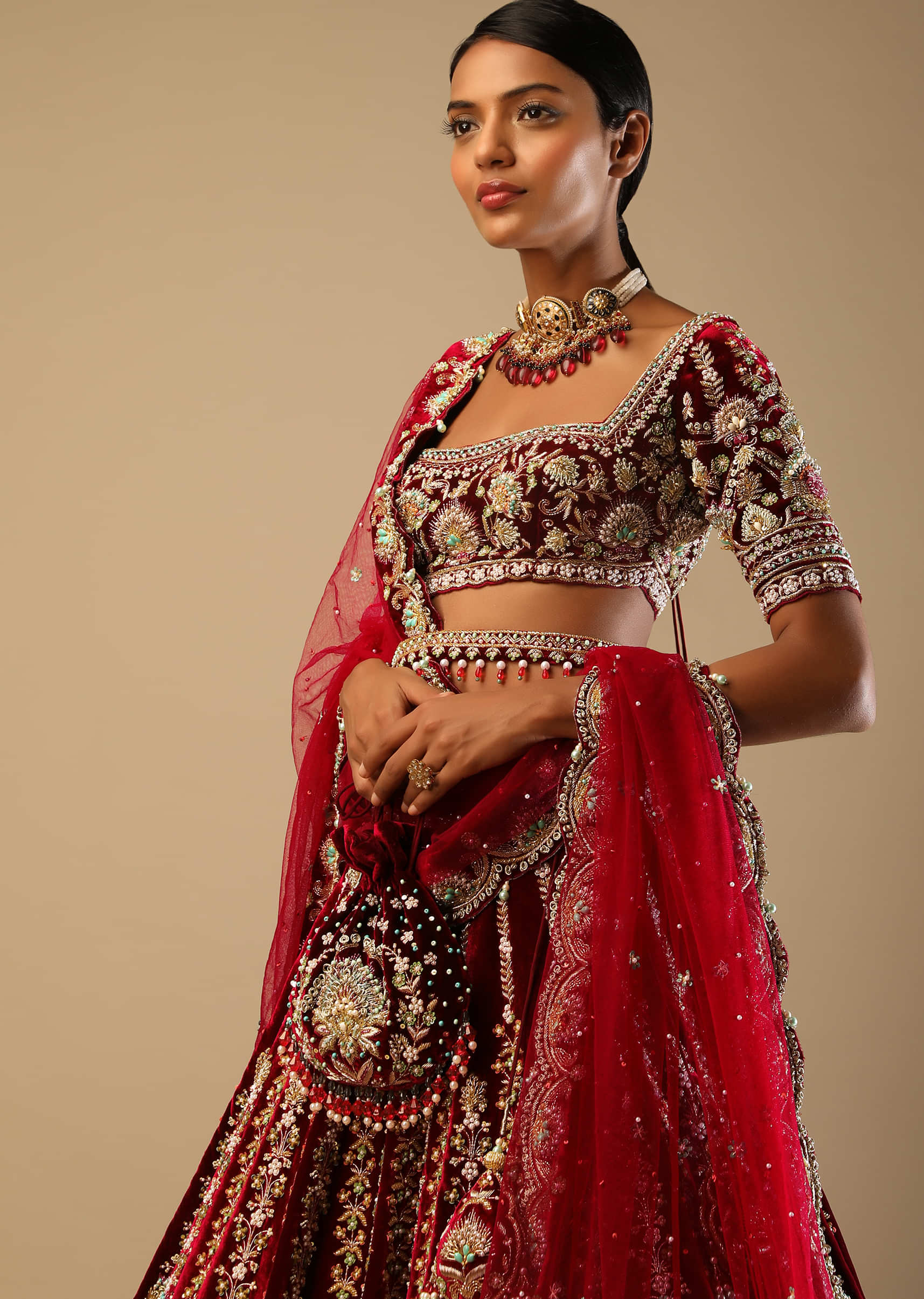 Persian Red Lehenga Choli In Velvet With Multi Colored Hand Embroidered Mughal Kalis And Floral Motifs 