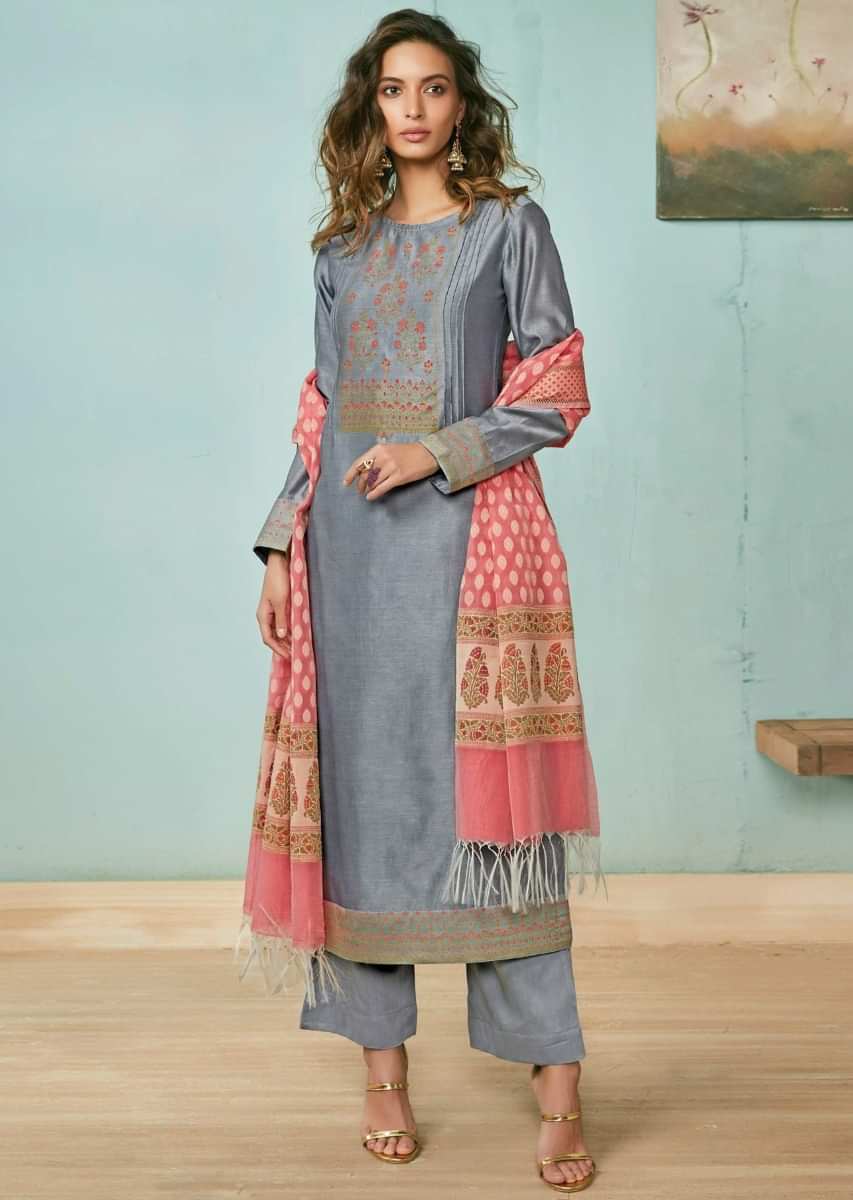 Pewter grey unstitched suit adorn in foil printed placket in floral motif matched with peach dupatta