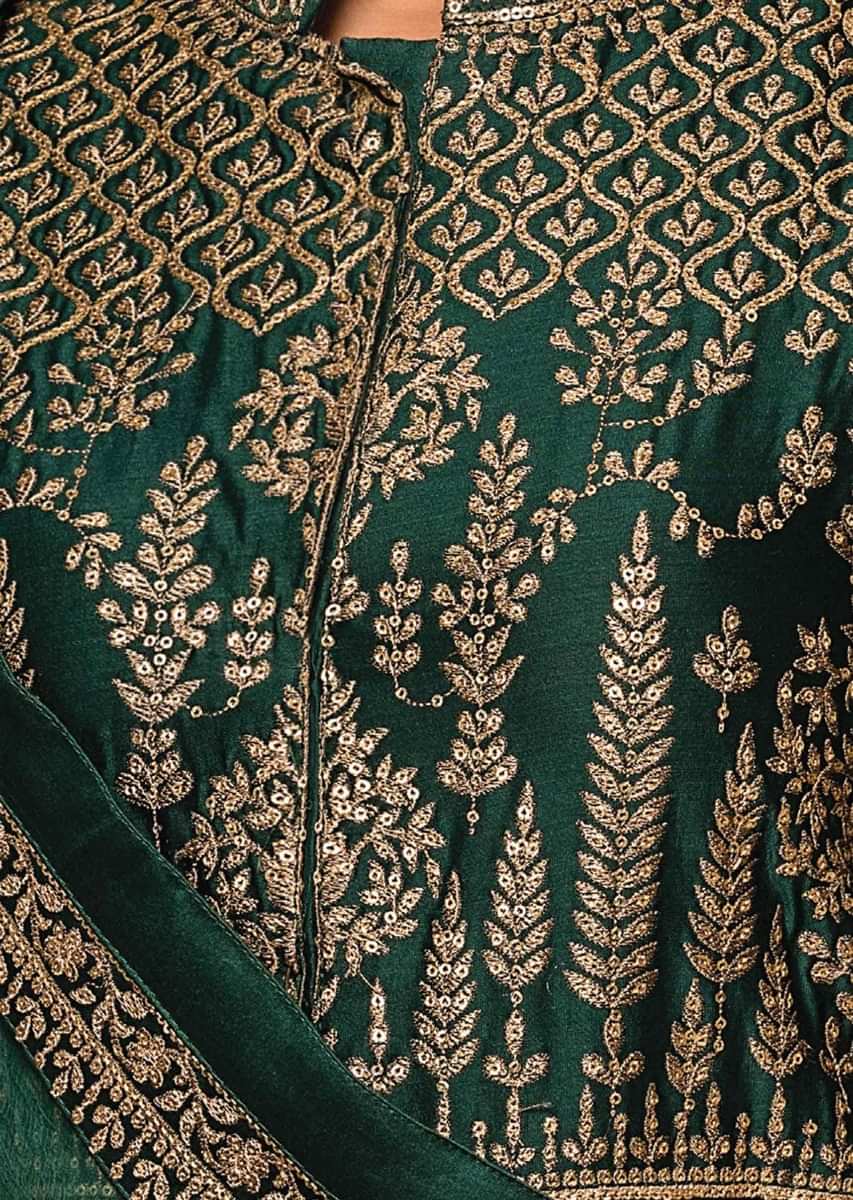 Pine green anarkali suit embellished in zari and sequin embroidery all over