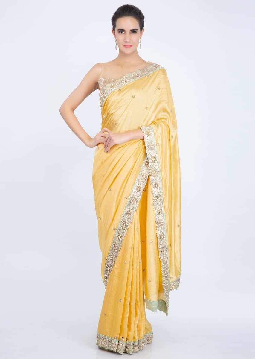 Pine yellow  saree with embroidered butti and border only on kalki
