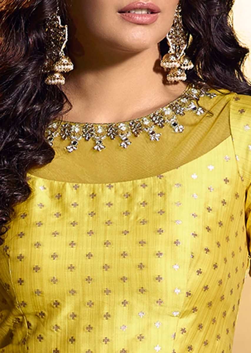 Pine yellow silk anarkali suit with weaved butti