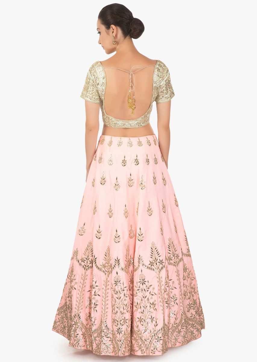 Pink lehenga with mint blouse and  a matching pink net dupatta with mint border only on Kalki