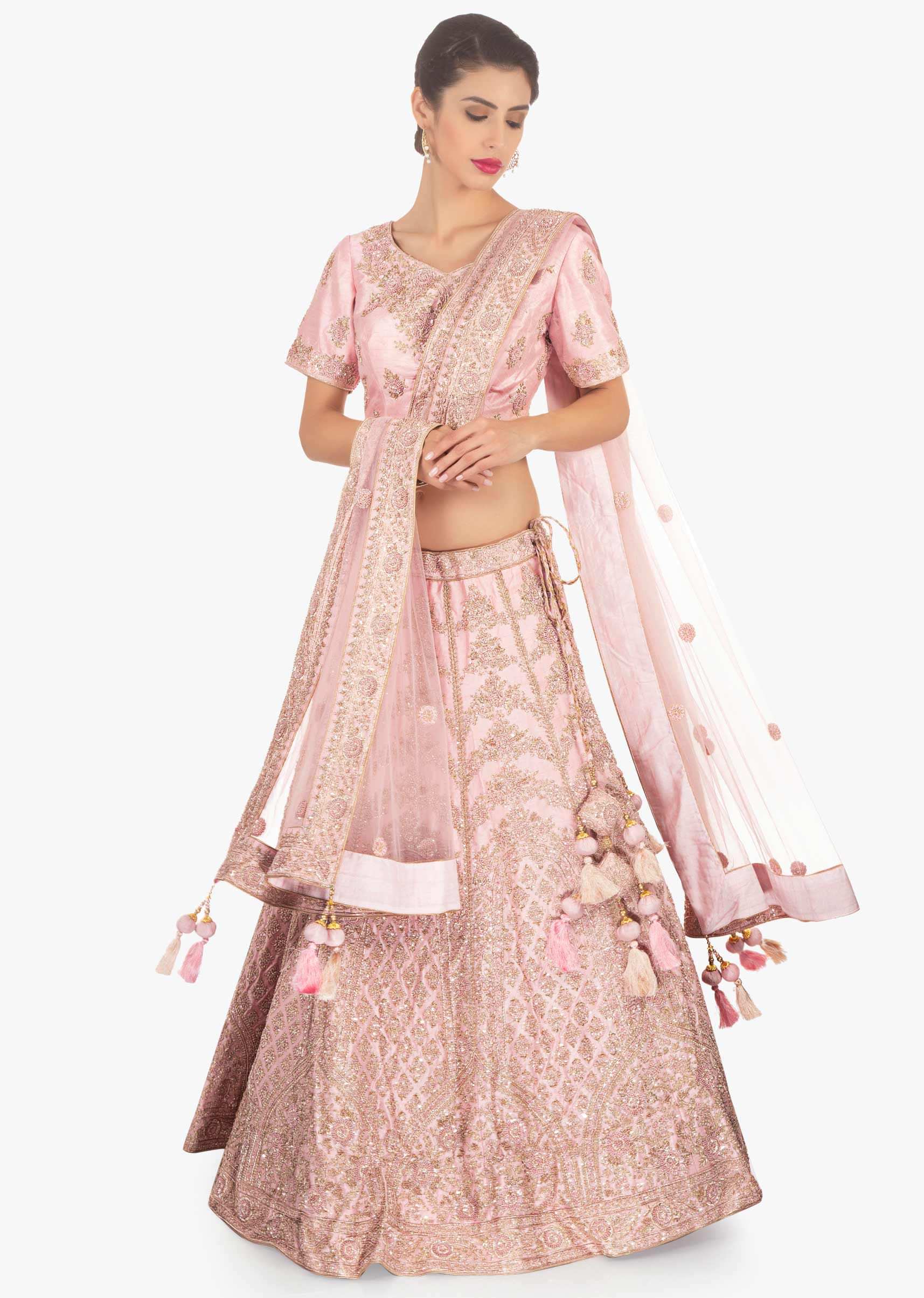 Pink raw silk embellished lehenga set paired with net  dupatta 