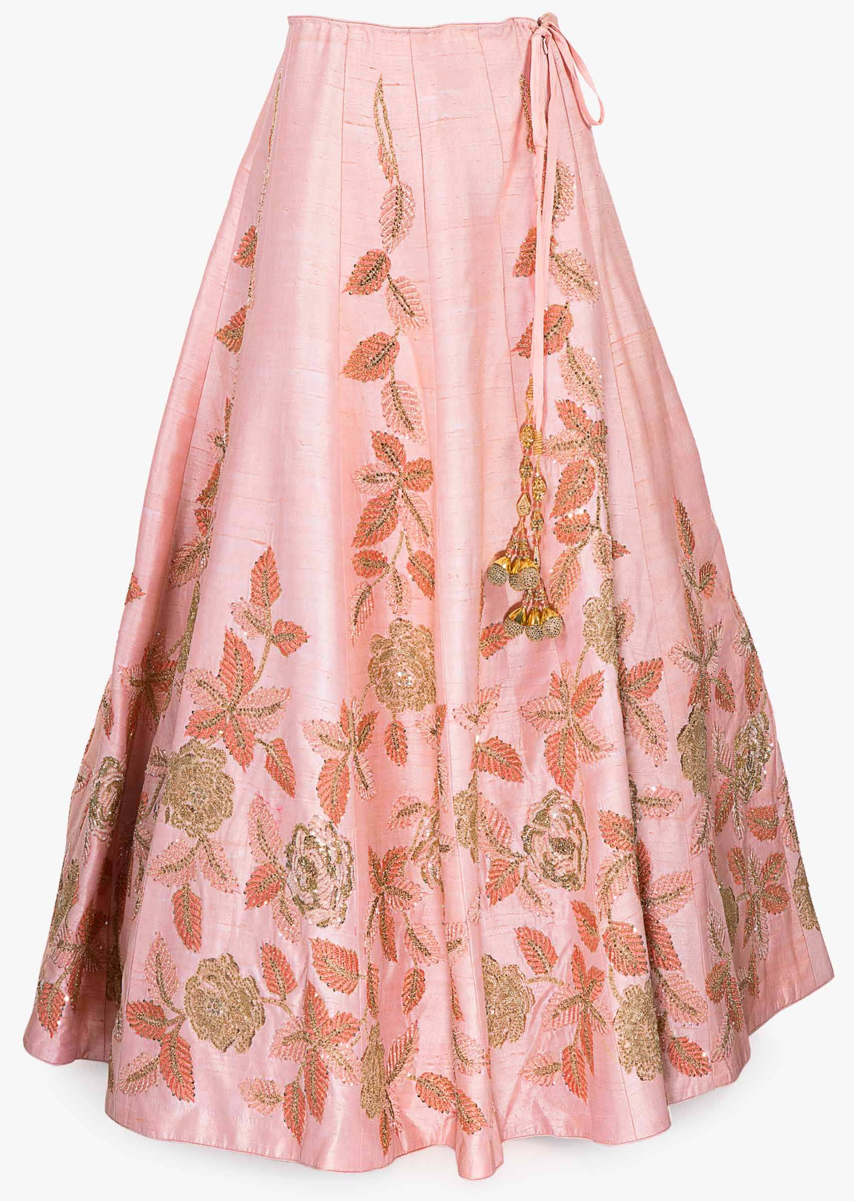 Pink raw silk lehenga paired with net dupatta and an unstitched embroidered blouse