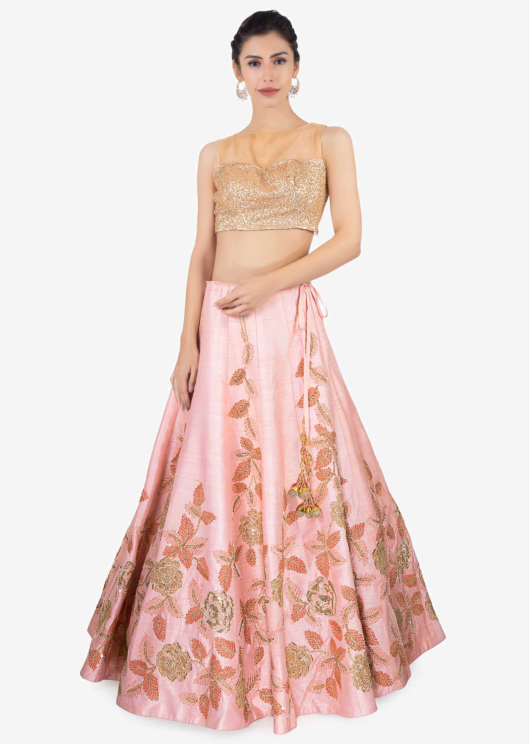Pink raw silk lehenga paired with net dupatta and an unstitched embroidered blouse