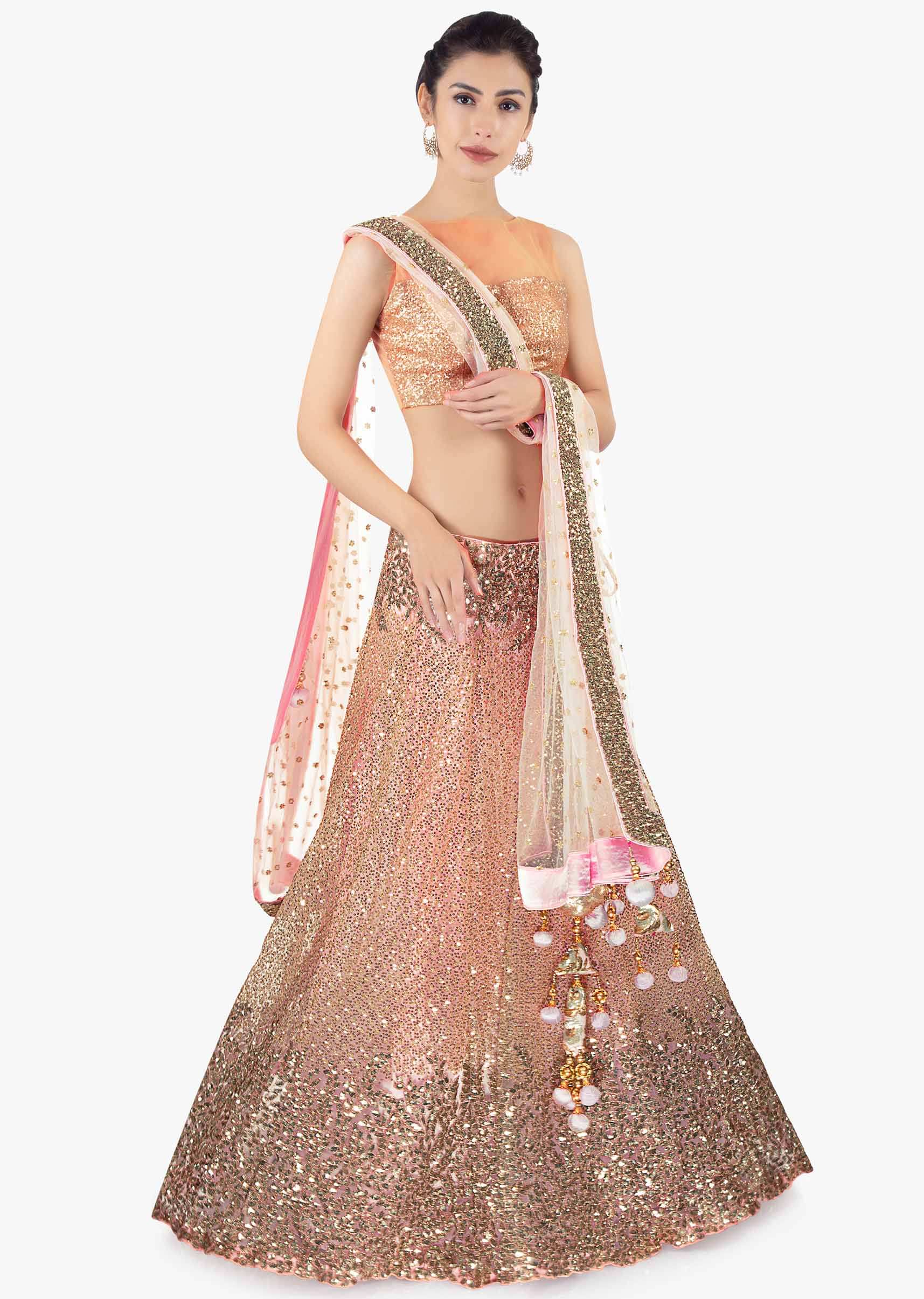 Pink sequins embroidered lehenga set paired with a matching net dupatta 
