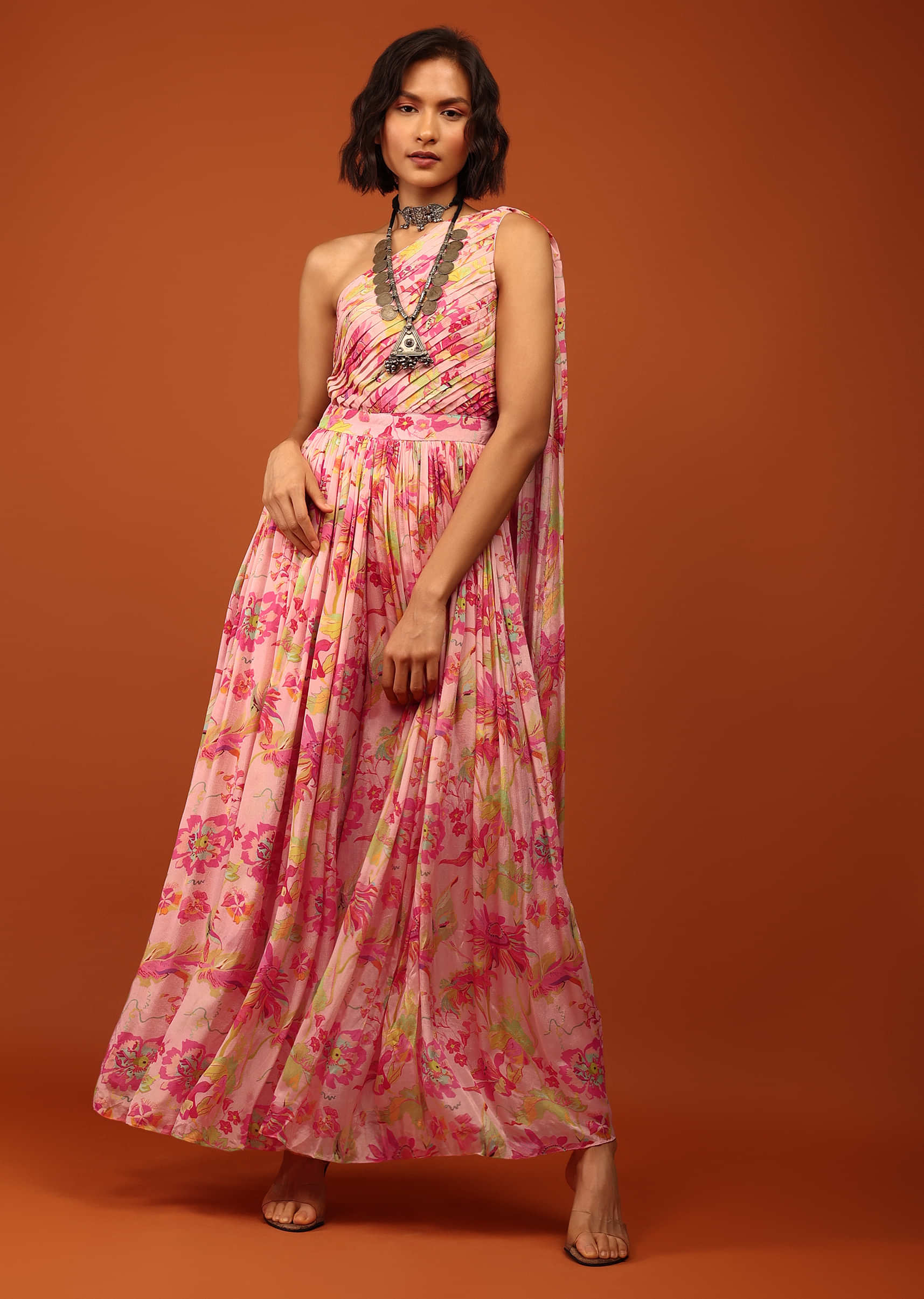 Blush Pink Floral Print Jumpsuit With Slantly Pleated Bodice And Attached Drape On The Shoulder