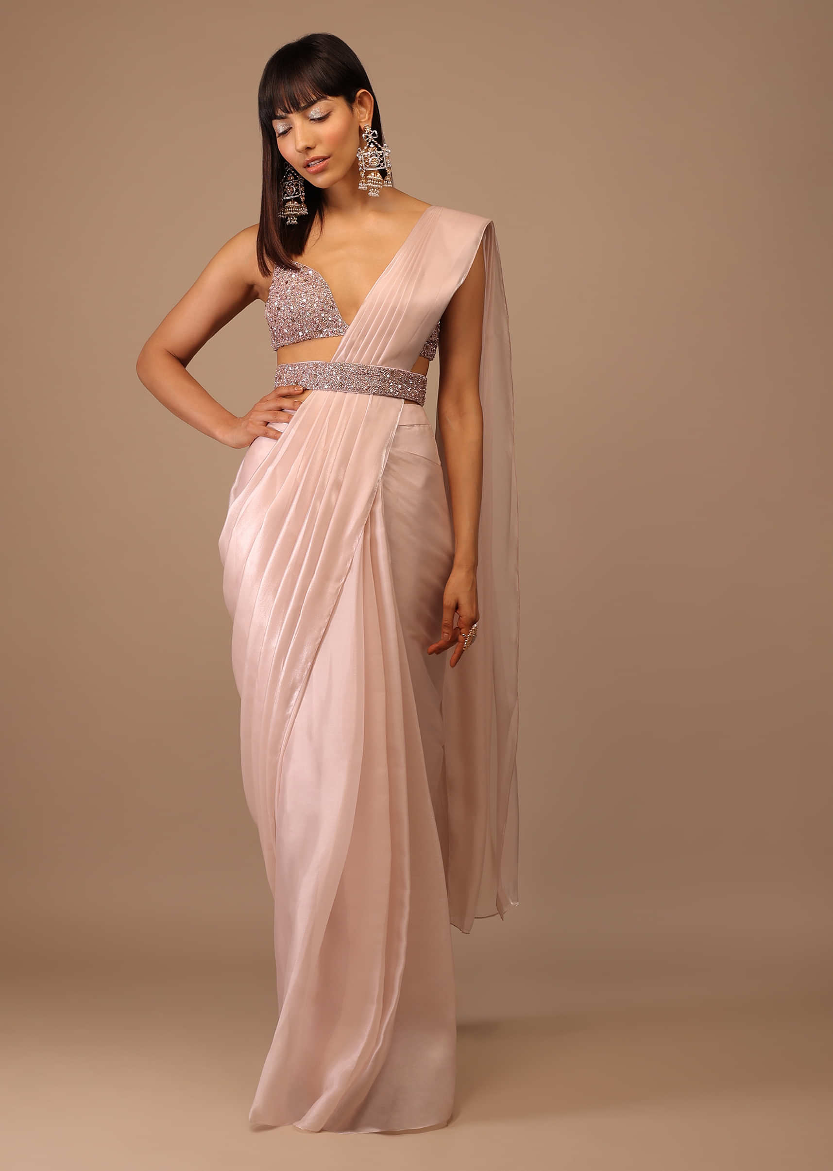 Pink Glossy Organza Saree With A Heavily Embroidered Bustier And Belt