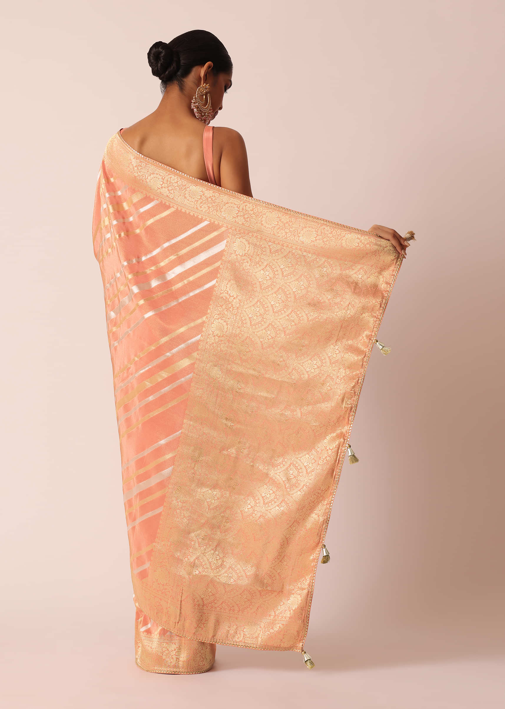 Peach stripe cotton saree with Dull gold filigree and dark pink border