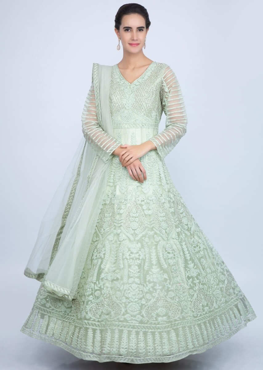Pista green heavy embroidered net anarkali in floral and jaal embrodiery only on Kalki