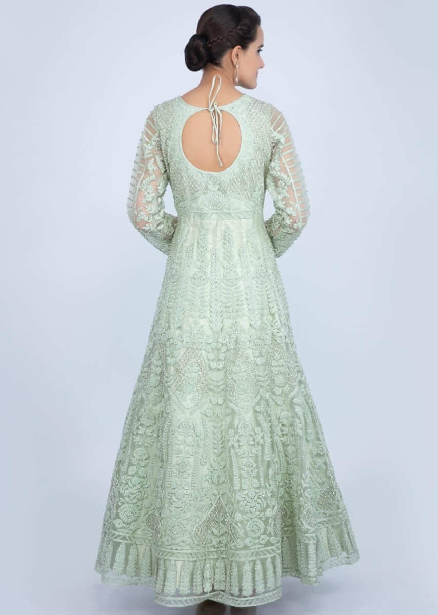 Pista green heavy embroidered net anarkali in floral and jaal embrodiery only on Kalki