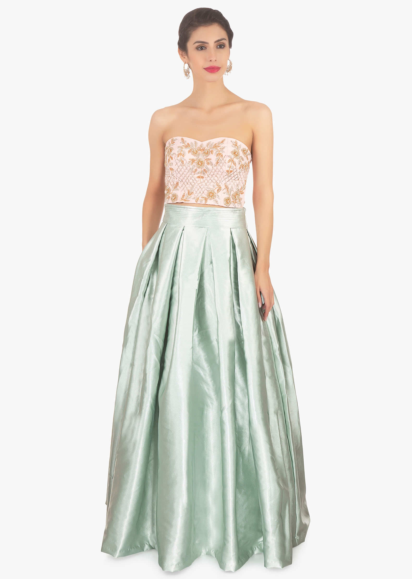 Pista green skirt paired with a strapless crop top and pink organza jacket