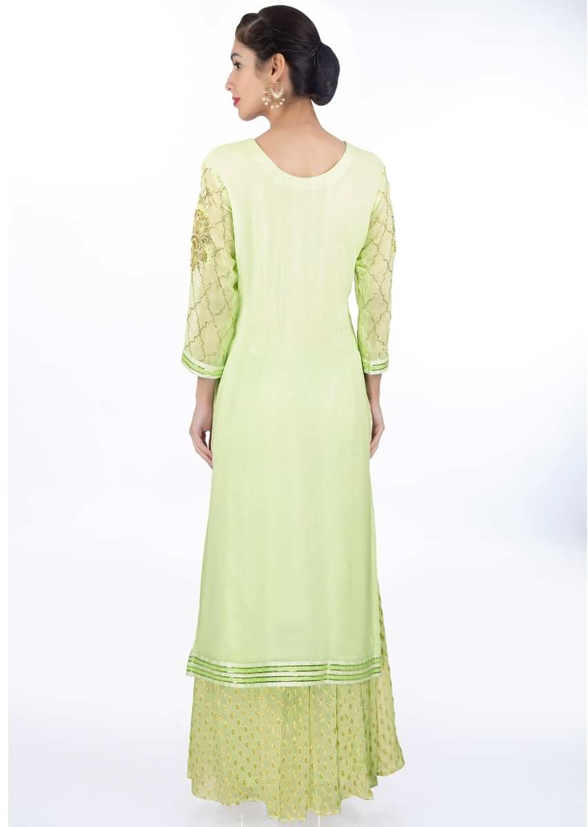 Pista green suit in moroccan motif paired with weaved palazzo and matching chiffon dupatta