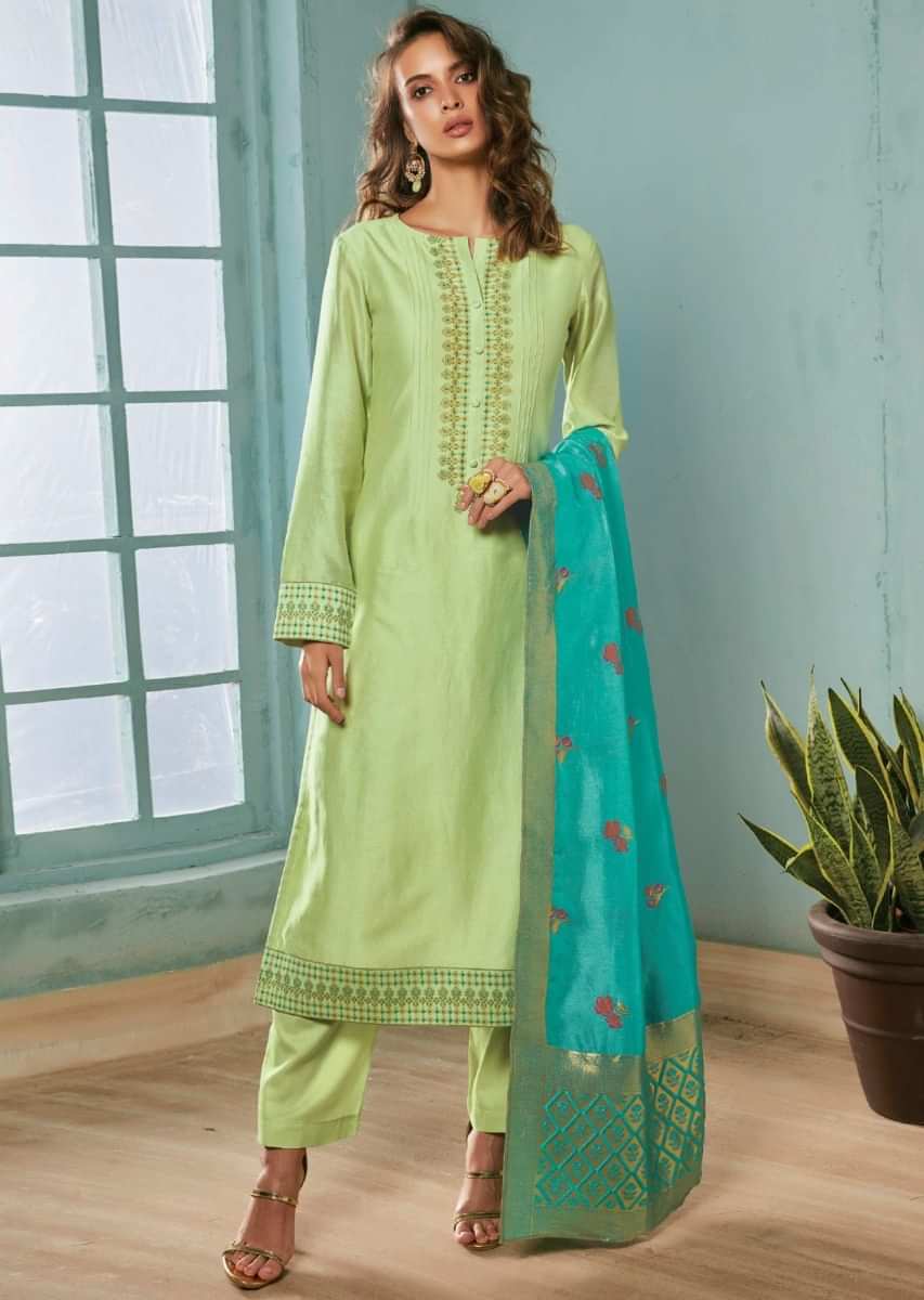 Pista green unstitched suit adorn in printed placket matched with  turq blue dupatta