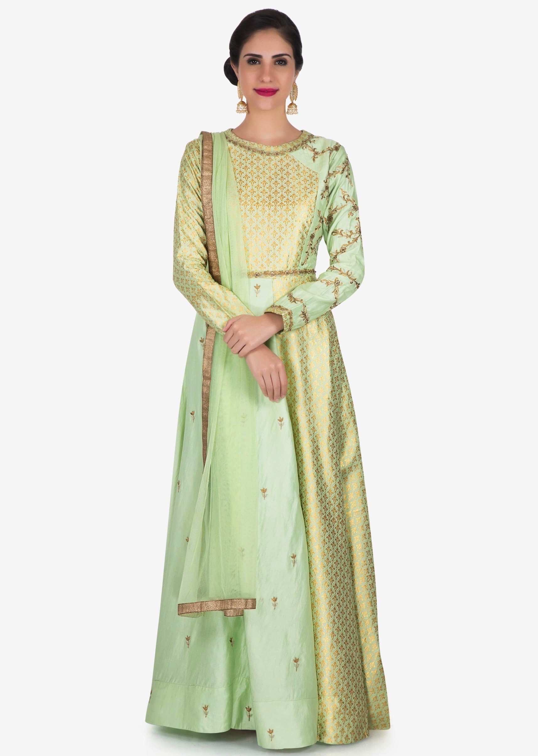 Pista anarkali suit in silk is adorn in foil print and zari embroidery work only on Kalki