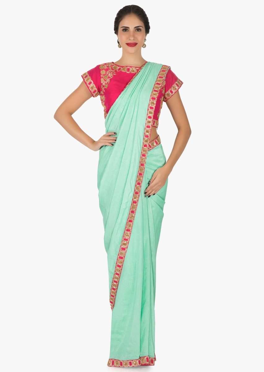 Pista green saree in cotton silk with rani pink blouse adorn in cutdana embroidery work only on Kalki