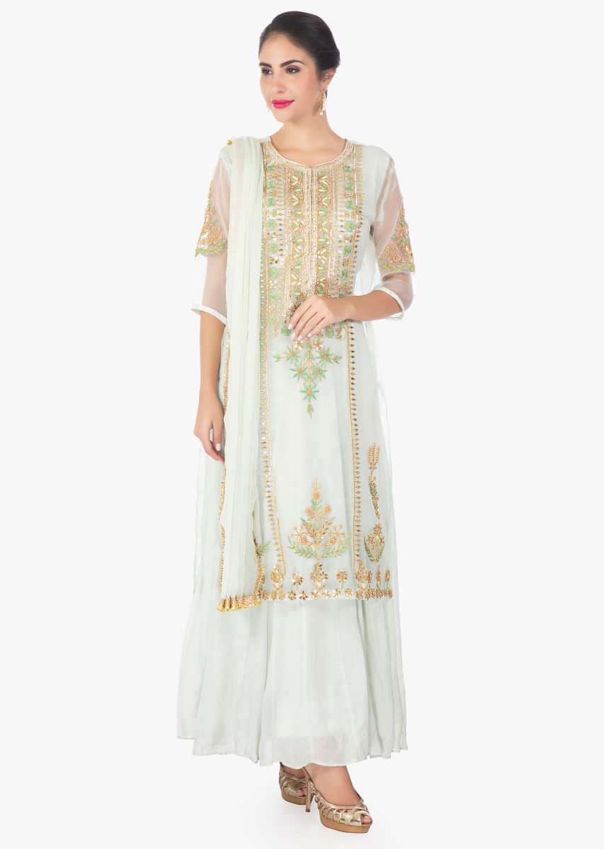 Pistachio green organza silk top paired with a cotton long inner and chiffon dupatta