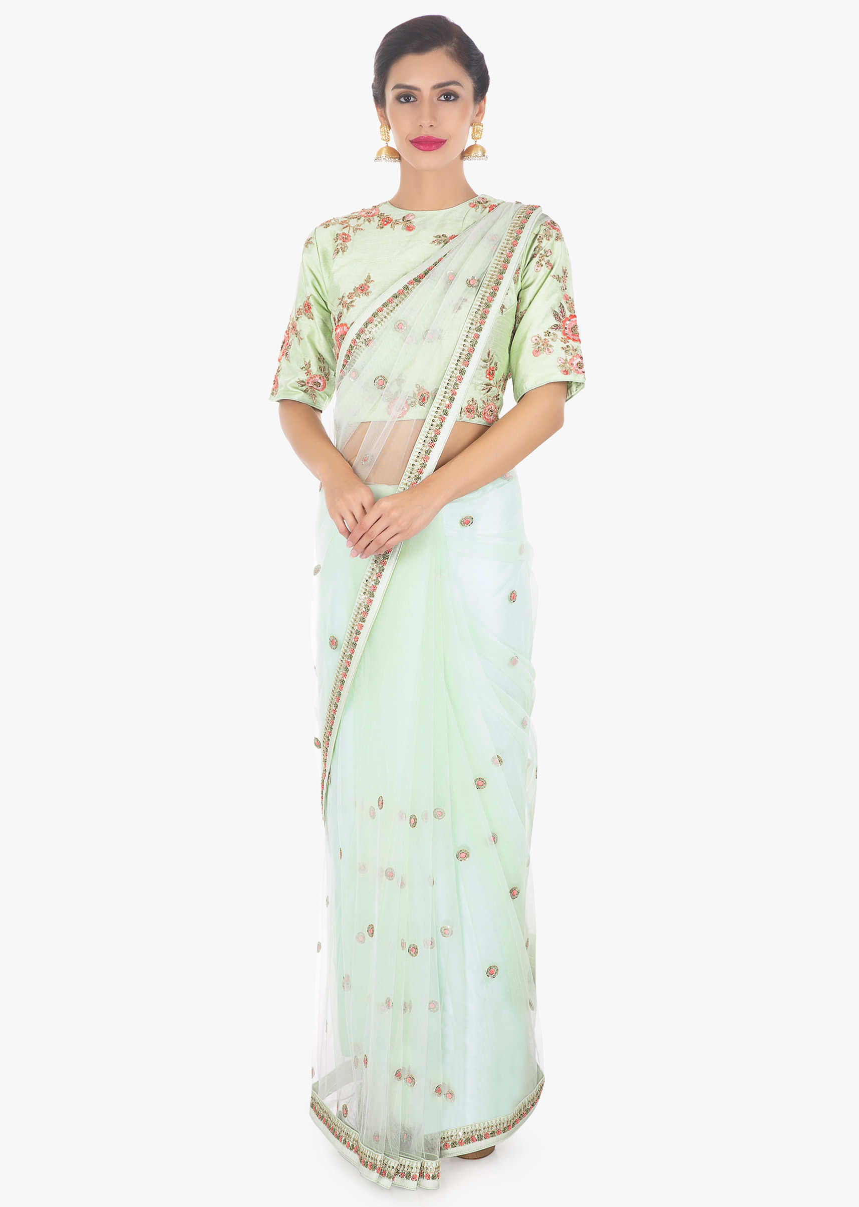 Pistachio net saree paired with a matching raw silk blouse 