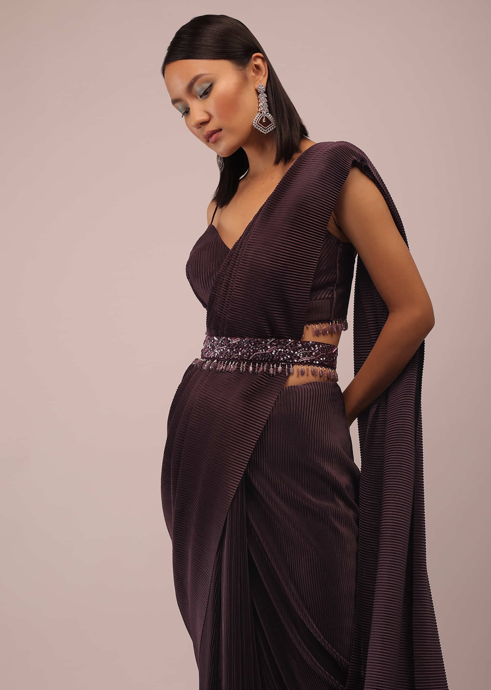 Plum Saree With Moti And Cut Dana Fringes Detailing On The Pallu And A Spaghetti Straps Crop Top With An Embroidered Belt In Fringes