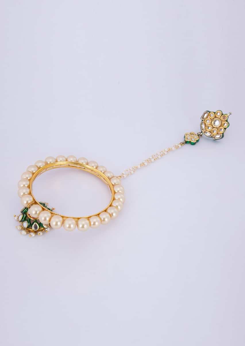 Polki kundan floral shape ring with attached kada adorn with cream pearls and jhumkas drop only on Kalki