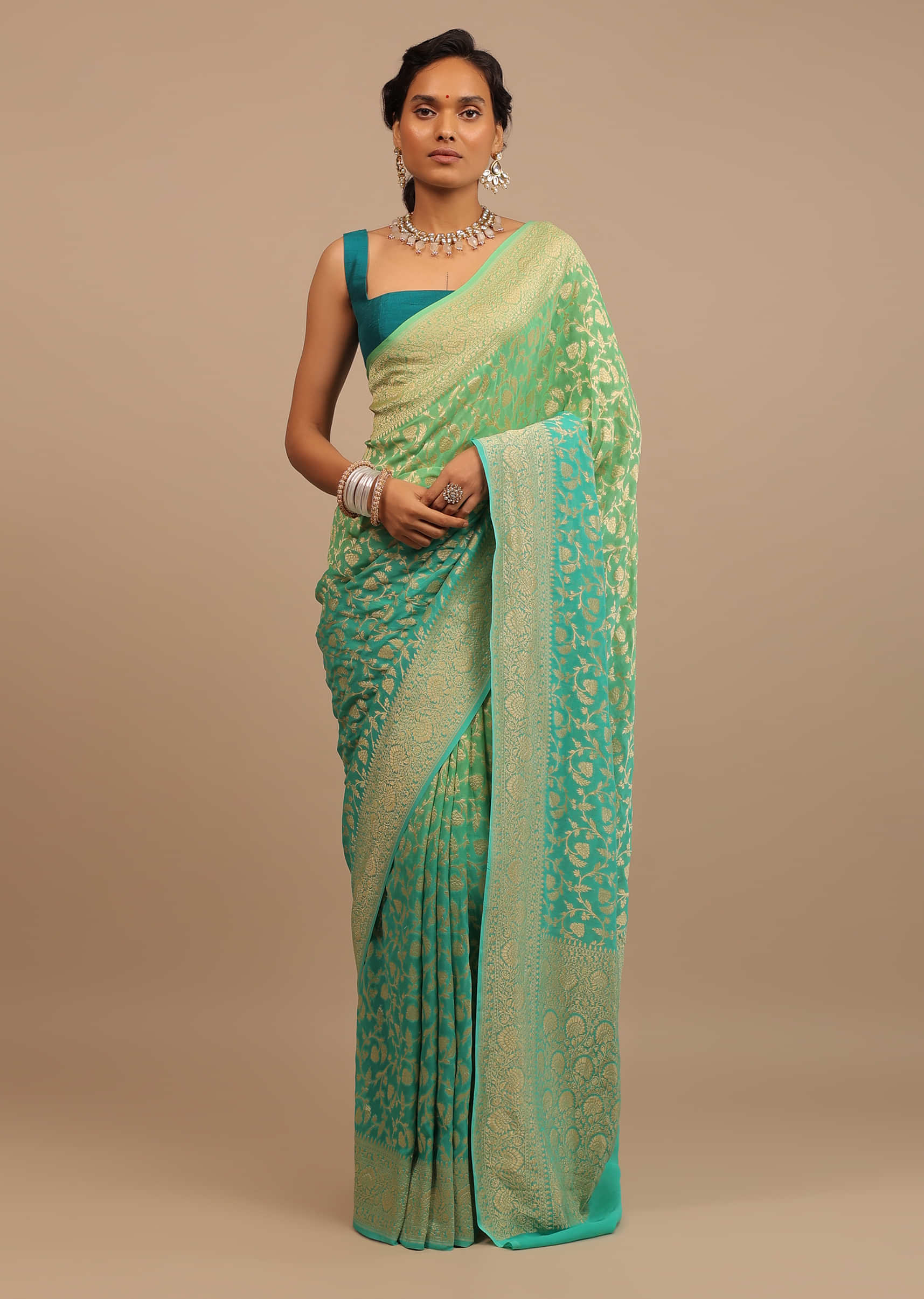 Jade Green Saree Made In Georgette And Beautified With Golden Jaal In A Floral Pattern