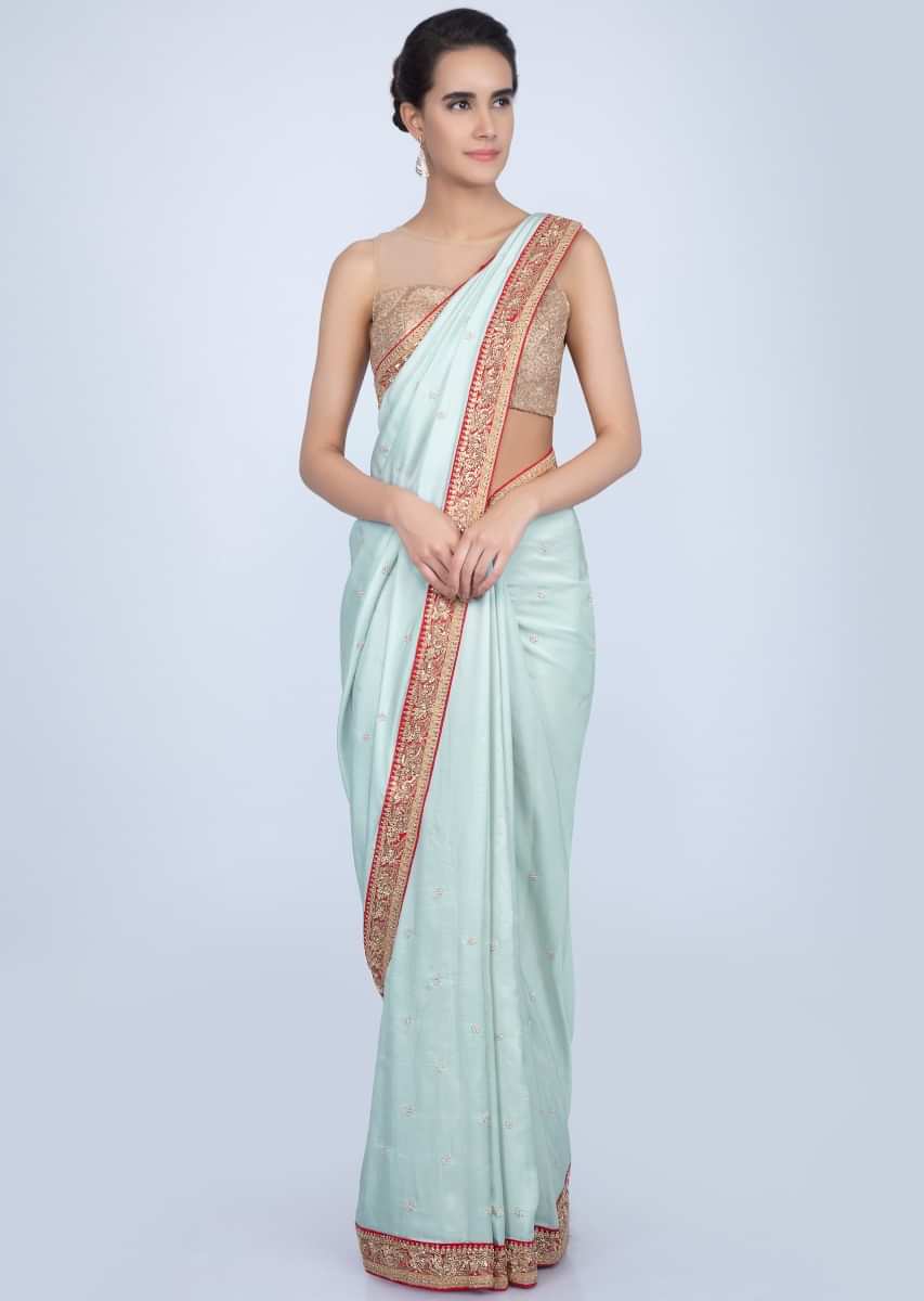 Powder blue dupion silk saree with contrasting embroidered border only on Kalki