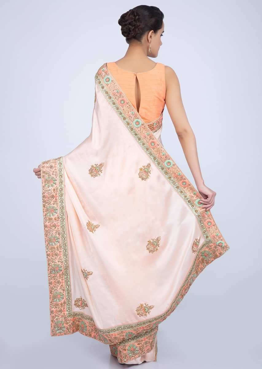 Powder Peach Saree In Satin With Butti And Heavy Embroidered Border Online - Kalki Fashion