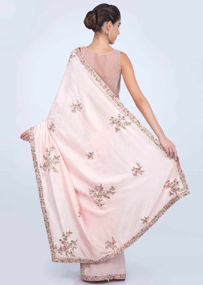 Powder pink dupion silk saree with florrla embroidered butti and border only on kalki