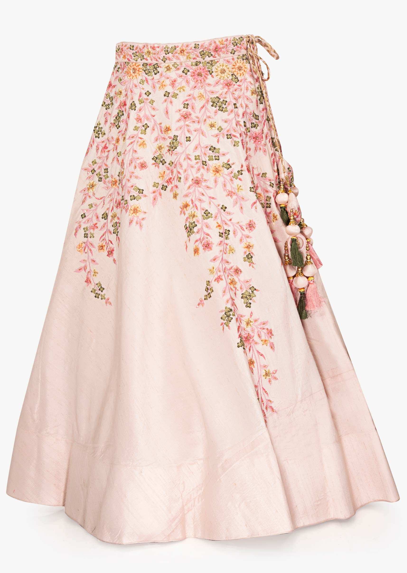 Powder pink lehenga paired with a matching blouse with a preattached net jacket