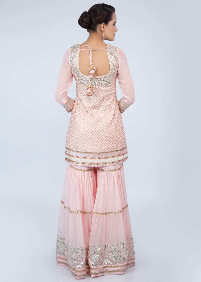 Powder pink sharara suit set with lace embroidery and butti only on Kalki