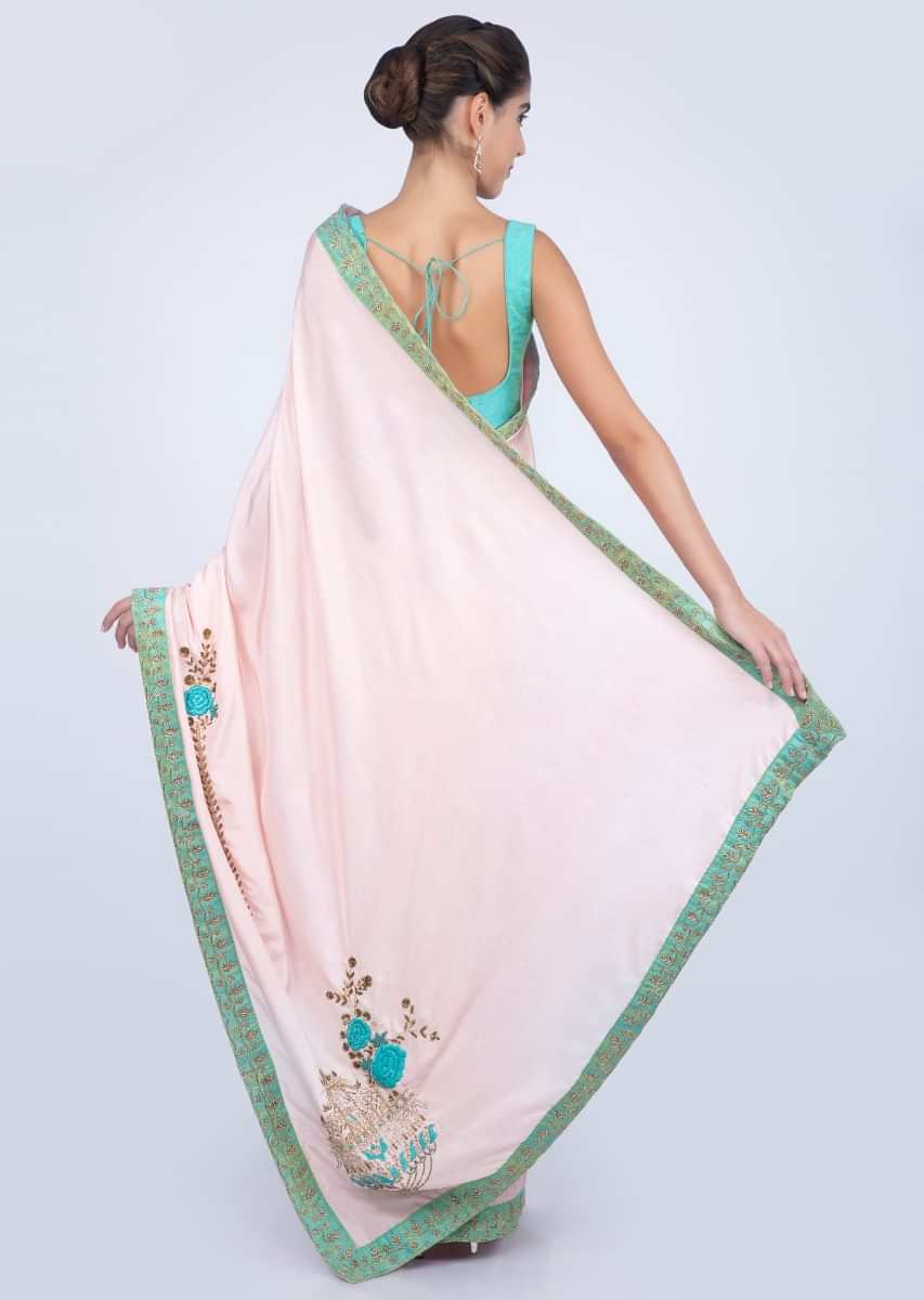 Powder pink silk saree with floral embroidered butti and border only on kalki