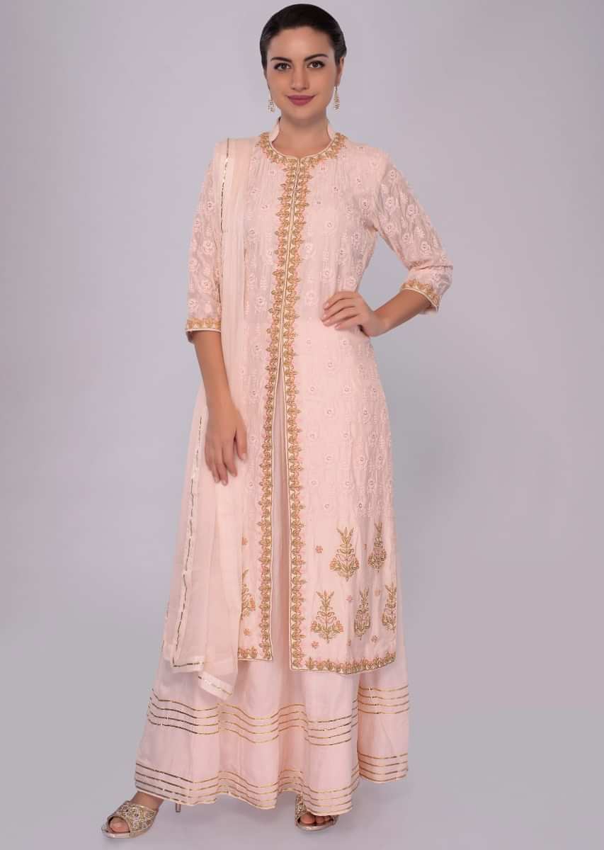 Powder pink suit with front and side slit with matching skirt and chiffon dupatta