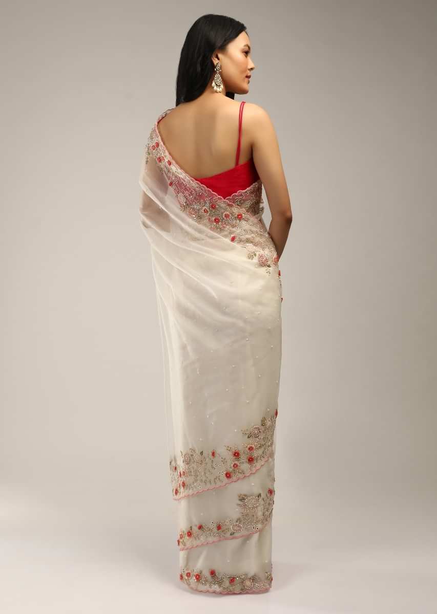 Powder White Saree In Organza With Colorful Resham Flowers On The Border Along With Moti And Cut Dana Accents  