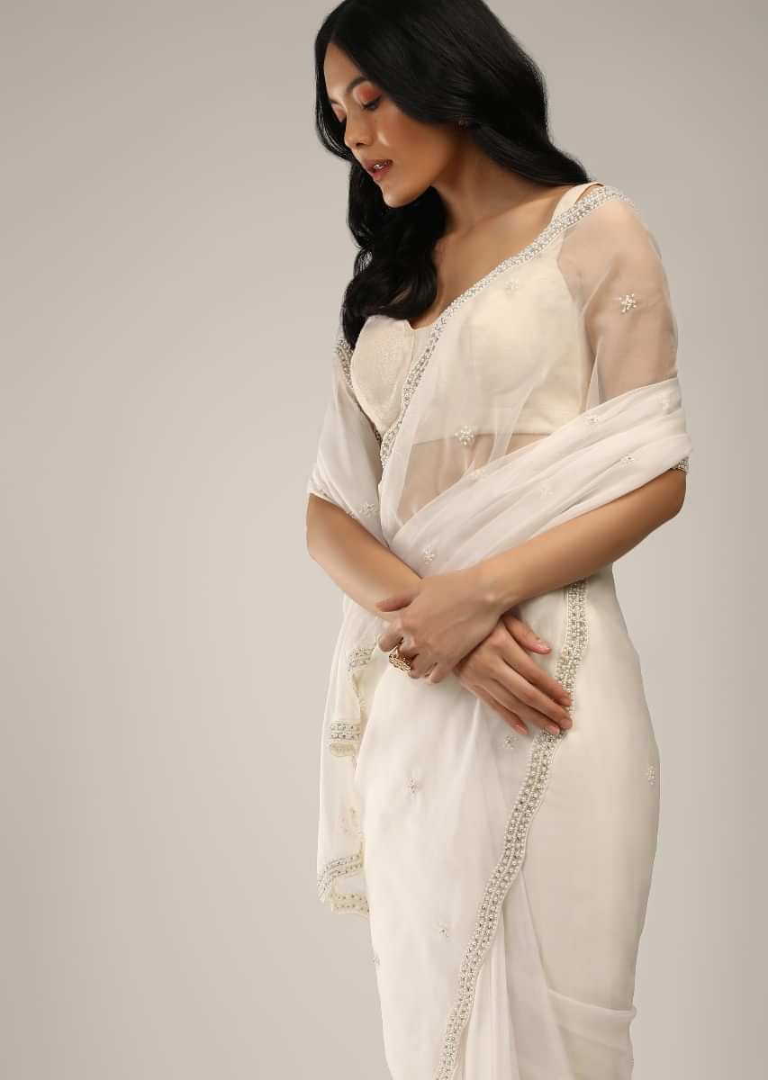 Powder White Saree In Organza With Moti And Stones Embroidered Border And Butti Design  