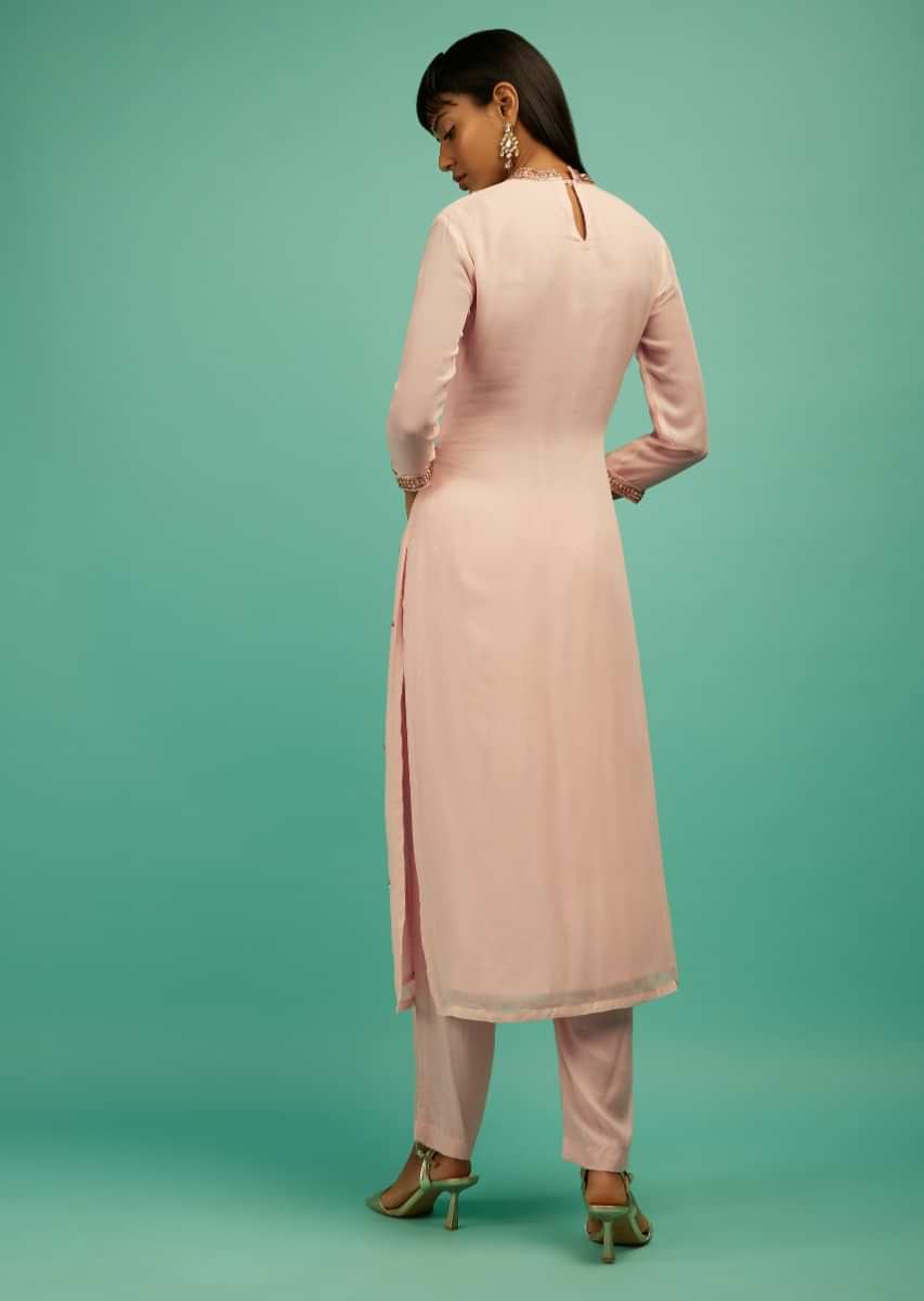 Powder Peach Straight Cut Suit In Georgette With Sequin Embellished Buttis  