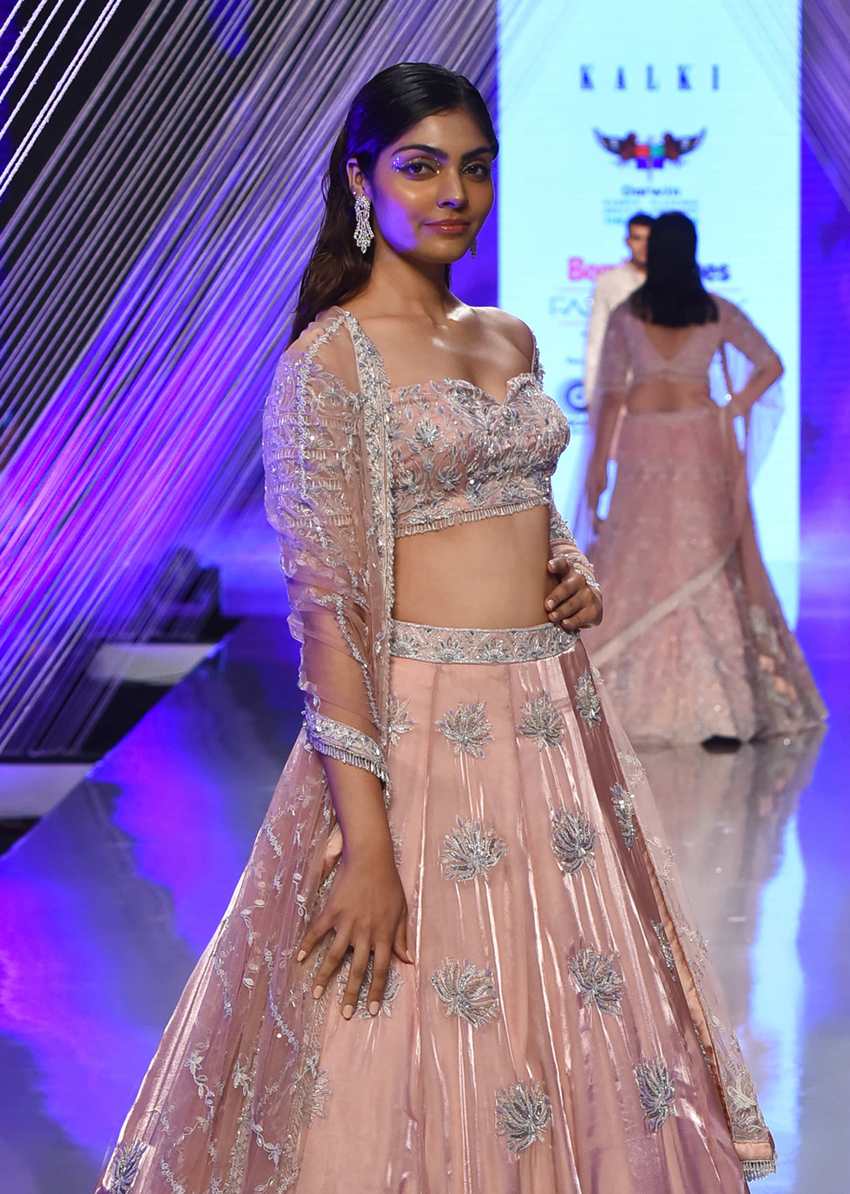 Powder Pink Lehenga And Off Shoulder Crop Top In 3D Floral Motifs Embroidery, Matching Net Dupatta With Stone Fringes